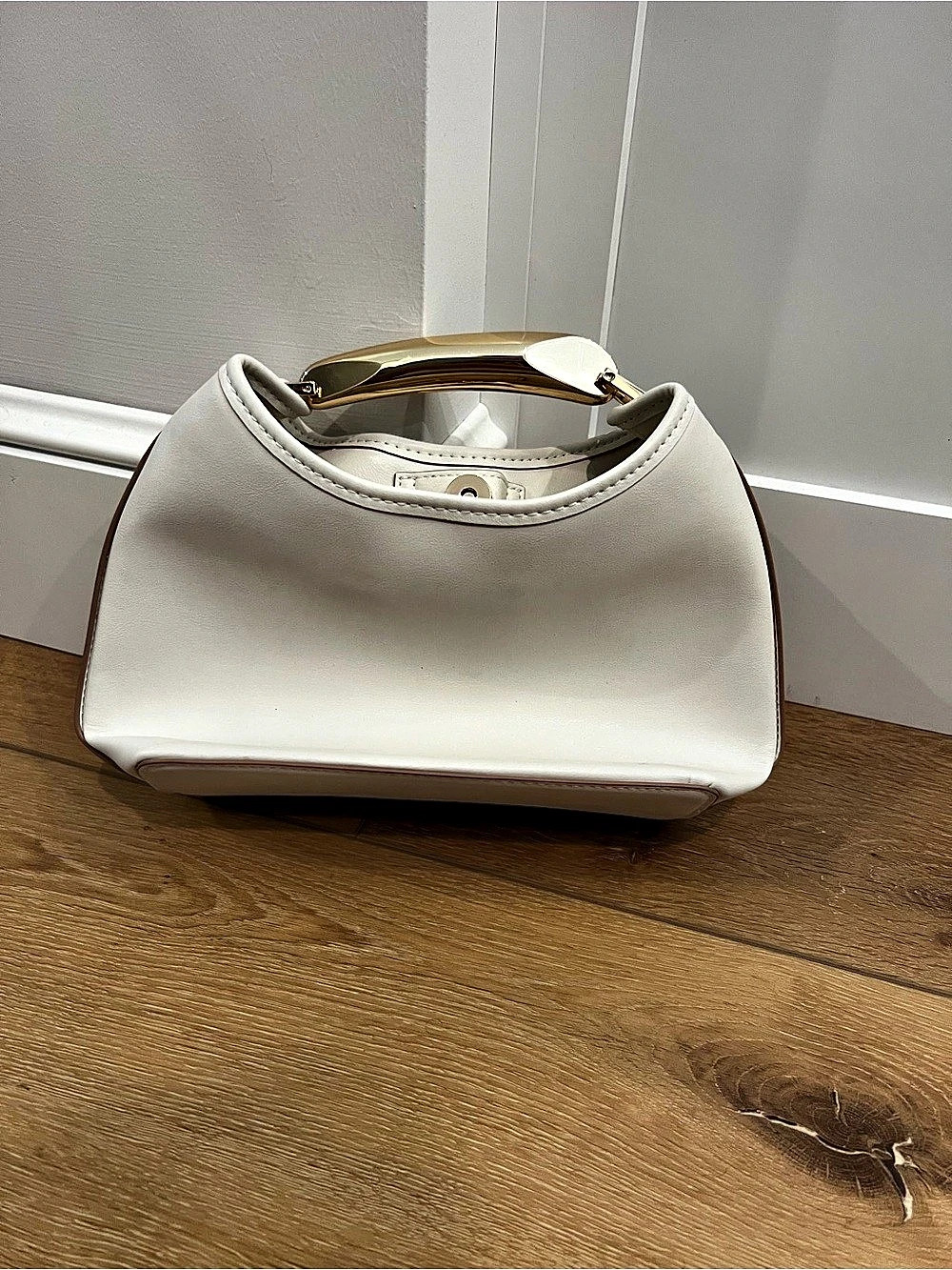 White small bag with gold handle